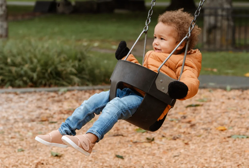 child on swings